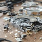 Disassembled hard drive with magnifying glass